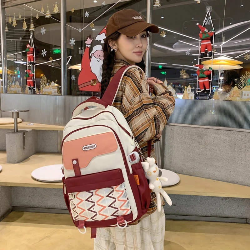 2025新款女初中生书包大学生减负护脊休闲双肩包大容量高中生背包