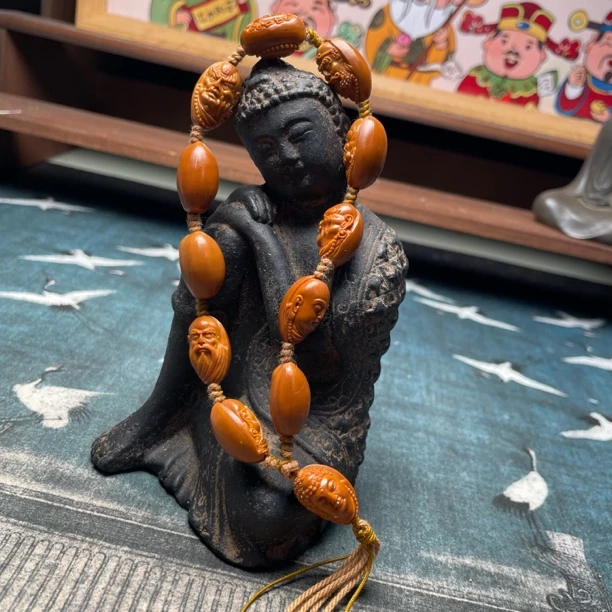 橄榄核雕刻子山十大弟子手持手串