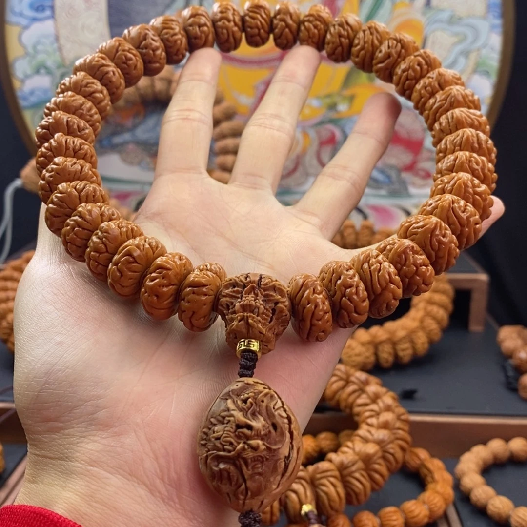 桃核手串前*龙纹桃核大肠