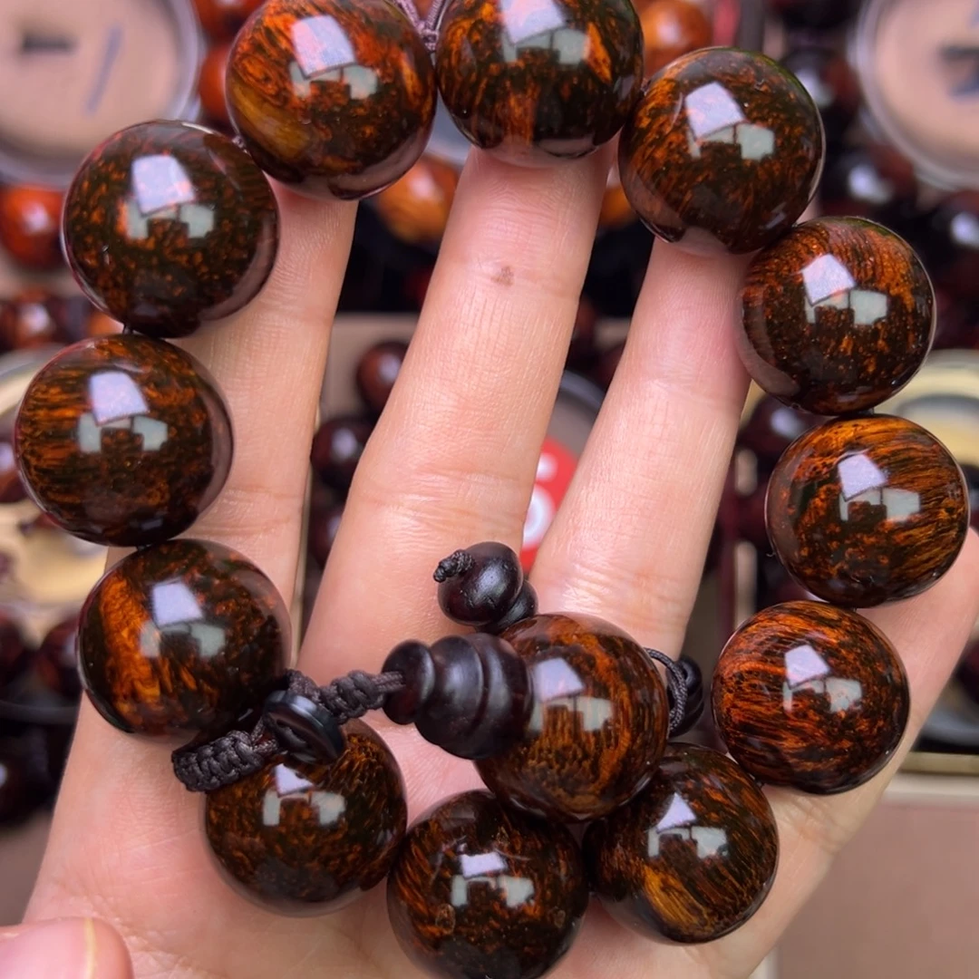 木质类黄花梨鬼脸对眼成品手串