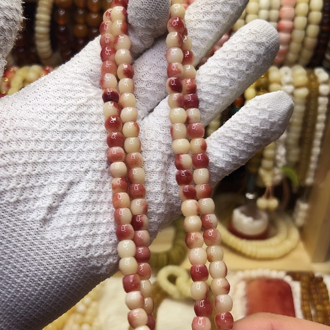 桃核把件0.8紫血驼骨108