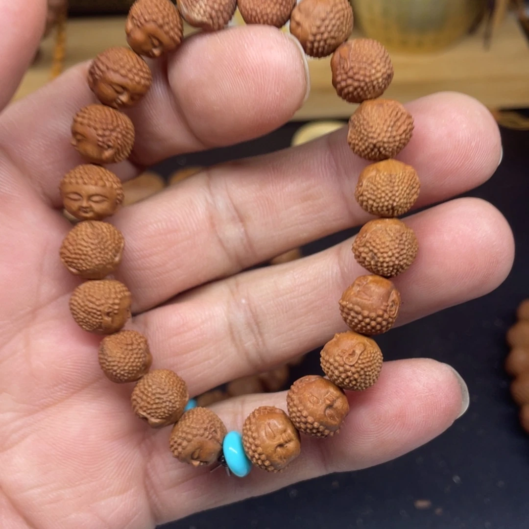 龙纹桃核雕刻宝宝佛头