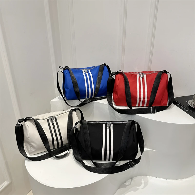 休闲百搭包包女2025新款时尚条纹牛津布单肩包网红洋气斜挎托特包