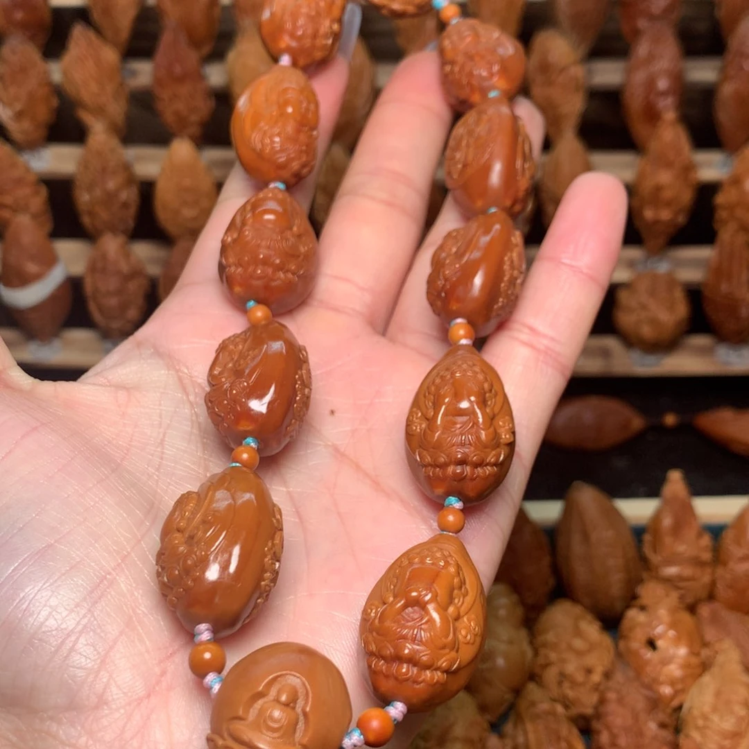 把件橄榄核豆*宝宝佛手持