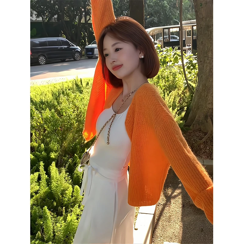 盐系高级感洋气减龄2025秋季新款橘色针织毛衣开衫显瘦白色阔腿裤