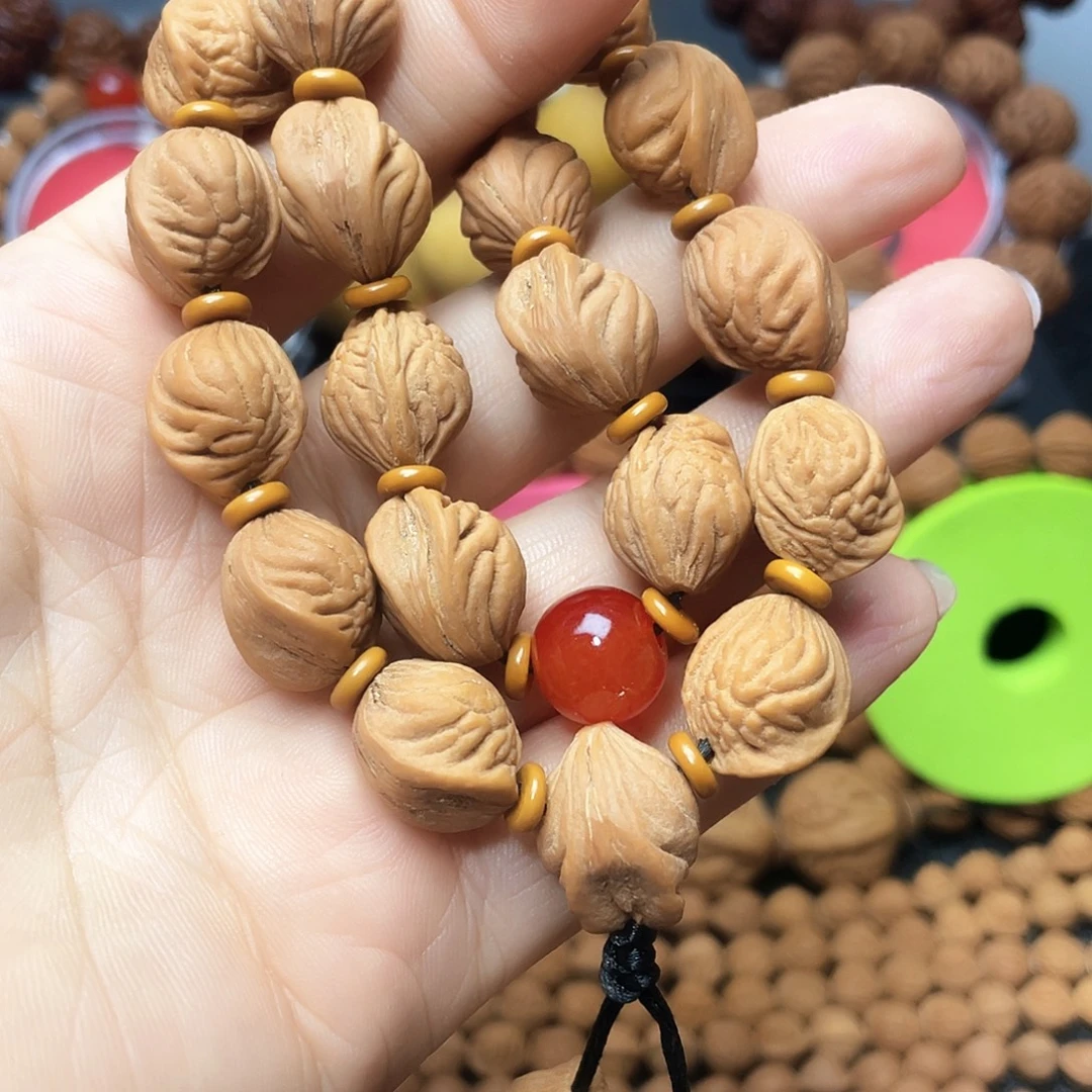 牧***人桃核把件生命开口笑手持13➕尺寸22颗带三通