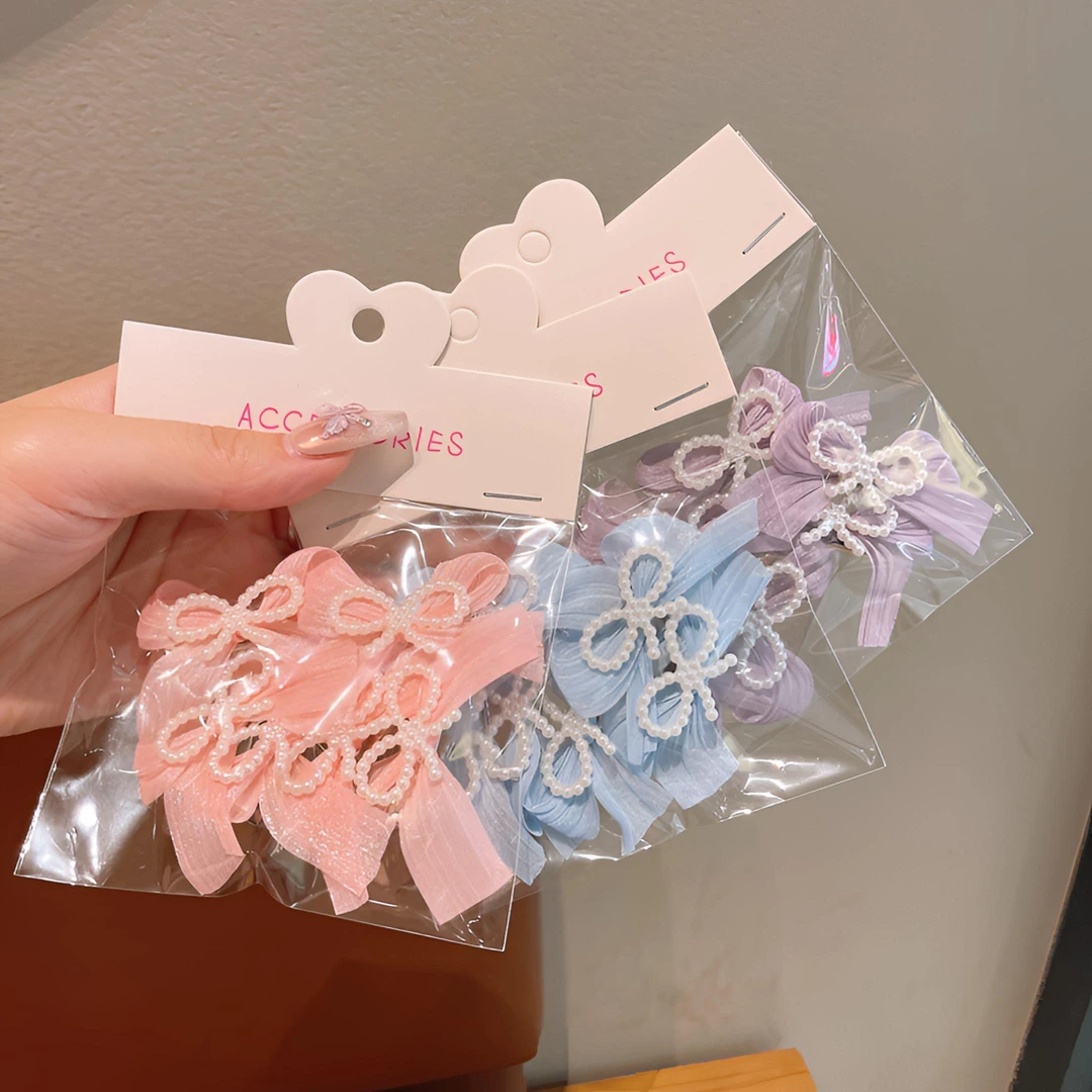 新款儿童蝴蝶结珍珠发夹女童侧边马尾刘海碎发卡六一表演发饰头饰