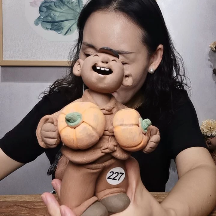 紫砂不规则羲娲娃系列作品抱双瓜男娃