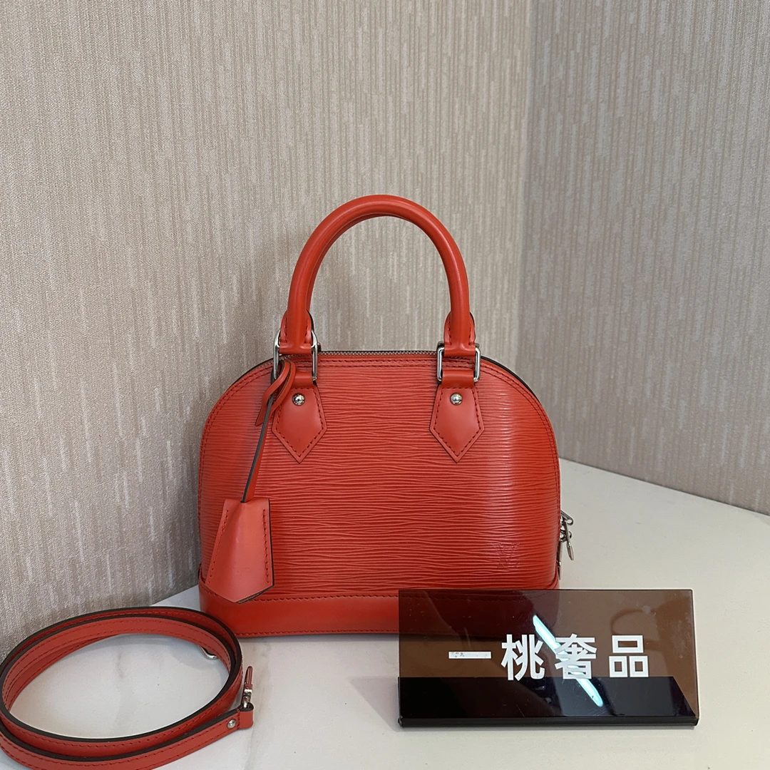 99新 LouisVuitton/路易威登 一桃/lv 水波纹红色贝壳手提斜挎