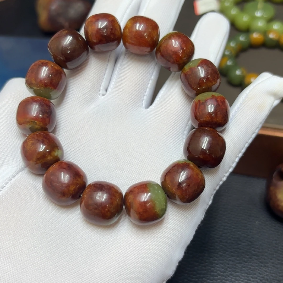 精品透闪石黄白火燎皮15×16手串