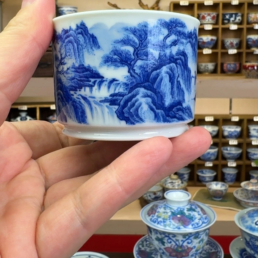 海***鸟溪山图手绘青花杯