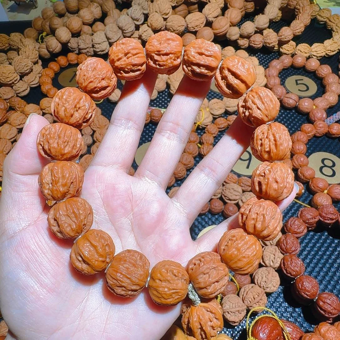 $****$文玩核桃吊坠树王京八棱手持