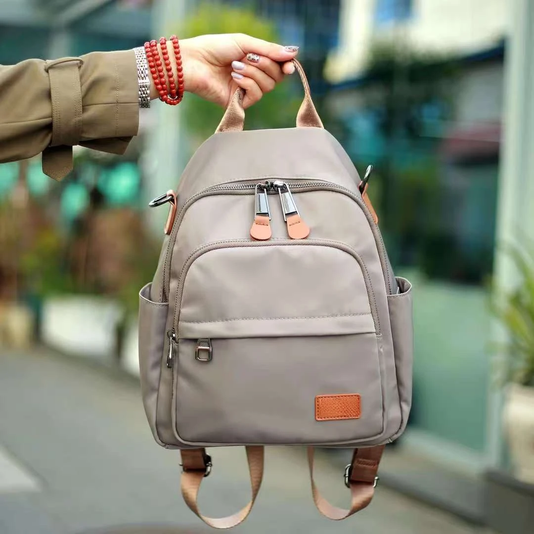 双肩包女2025新款大容量多隔层女士通勤旅行背包简约百搭防水背袋