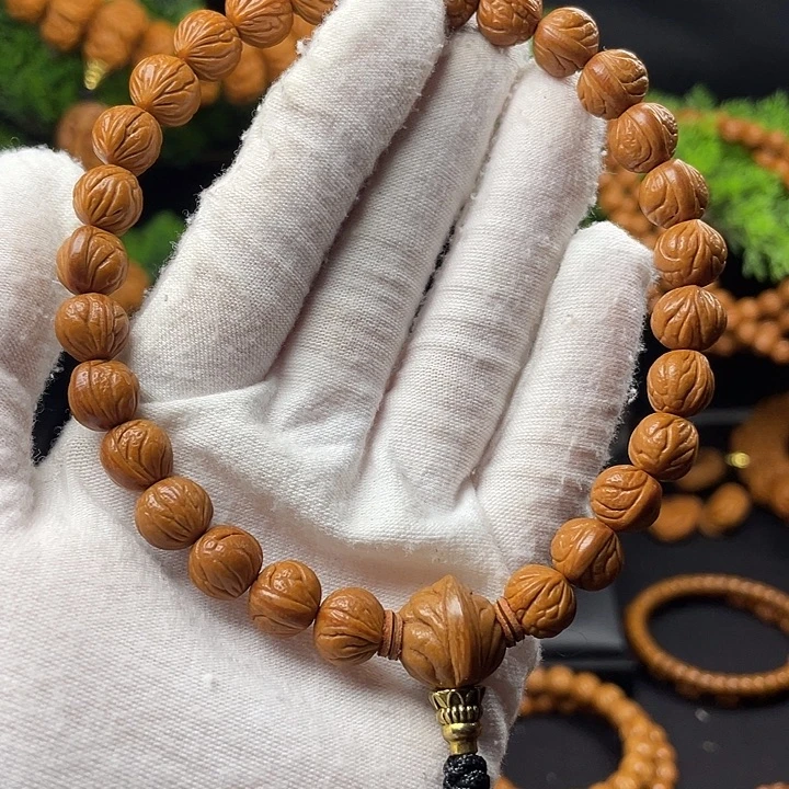 萬***.桃核吊坠秦岭龙纹桃核