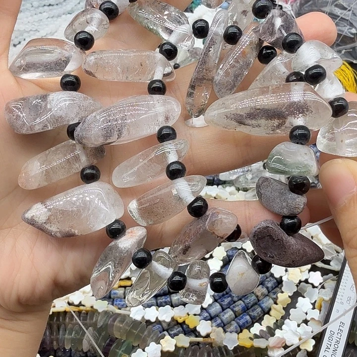 未镶嵌珠宝半成品水晶红皮幽灵长牙一条