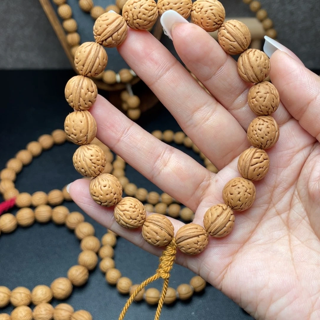 海****211.7野生红皮肌肉桃核手持