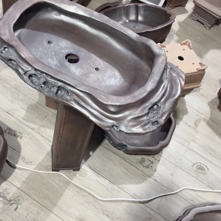 维***尼紫砂花盆宜兴紫砂工艺厂。