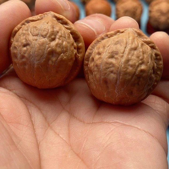 文玩核桃把件精品文玩手捻元宝墎元