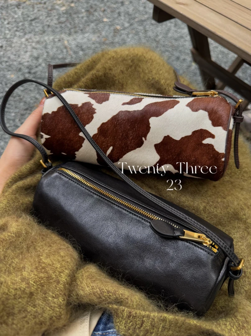 TwentyThree复古风奶牛纹小圆筒腋下包慵懒感手提斜挎简约笔袋包