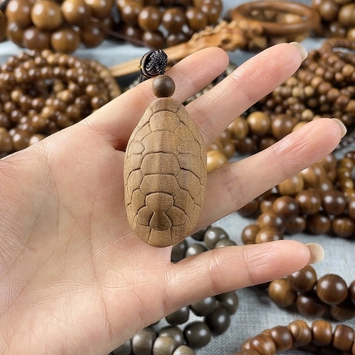 木老山檀富甲手把件