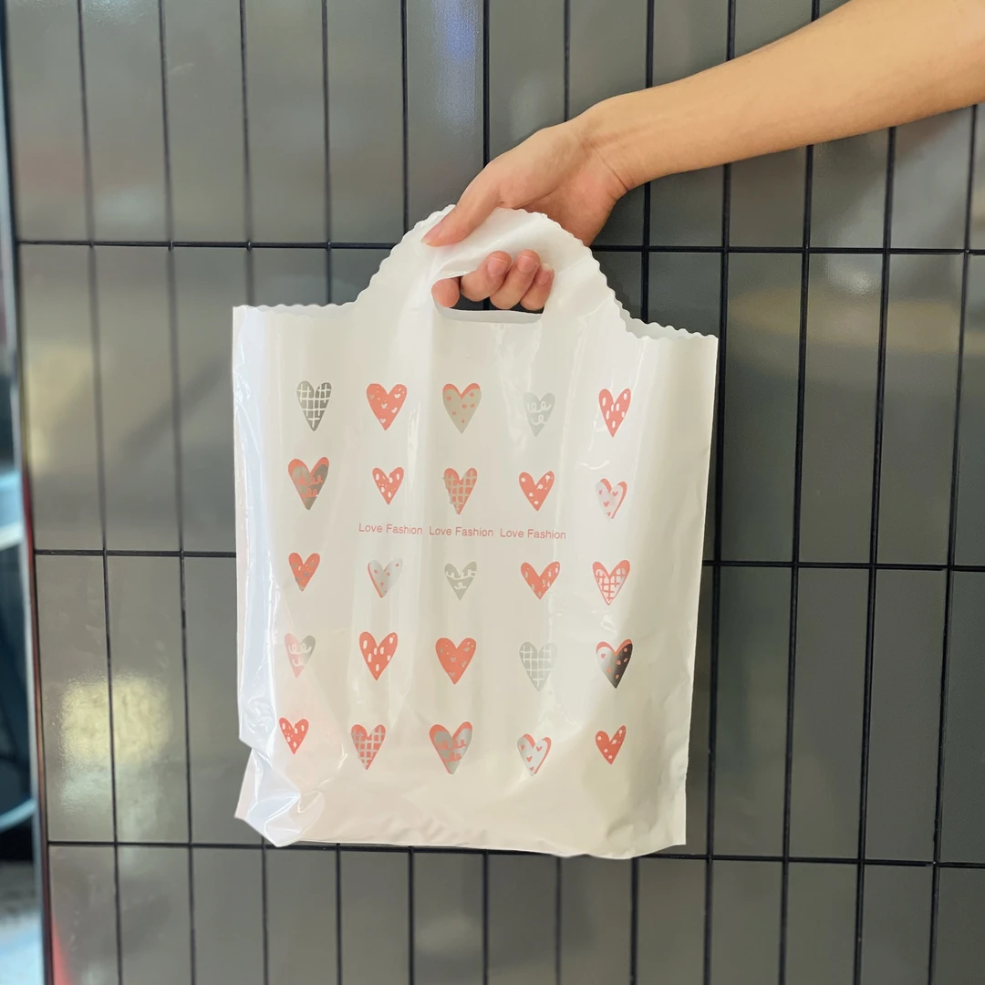 中厚爆款双面爱心圆弧塑料饰品袋化妆品袋手提礼品袋