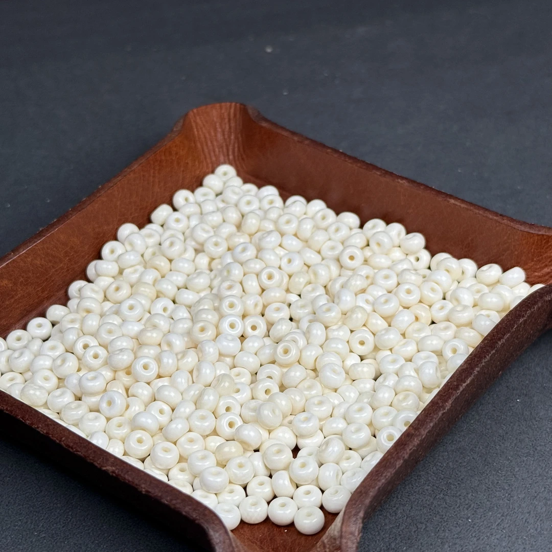 A234润白牙心料隔珠6X4㎜ 6片装 已扩1.5㎜孔