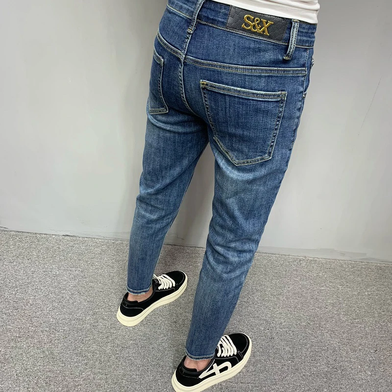 修身牛仔裤男秋冬新款高端轻奢潮牌水洗蓝色休闲弹力小脚九分裤子