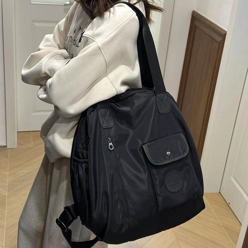 大容量双肩包女2025新款帆布旅游包轻便多功能旅行单肩背包托特包