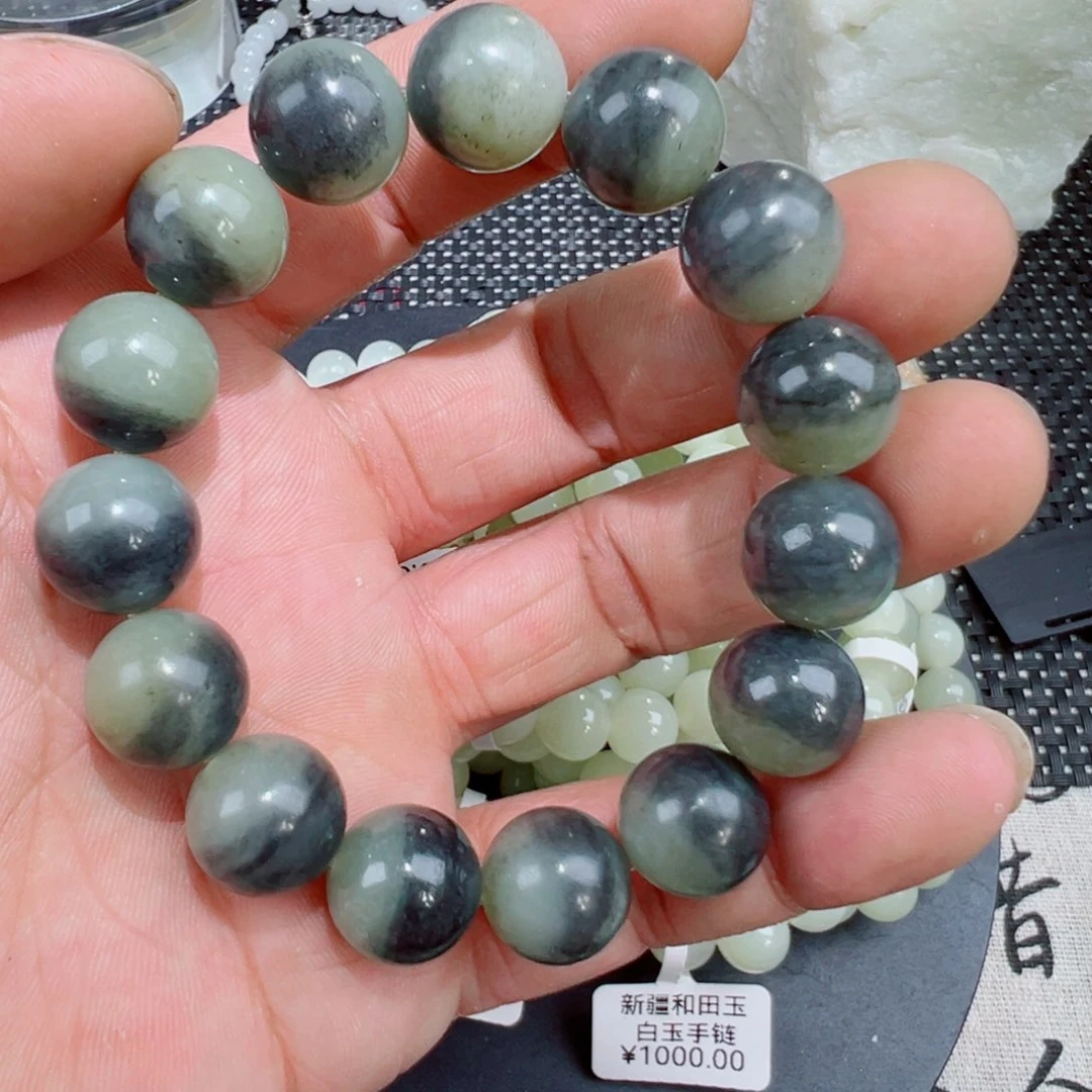 何***生和田玉（墨玉）未镶嵌套链卡十四多样性发其一