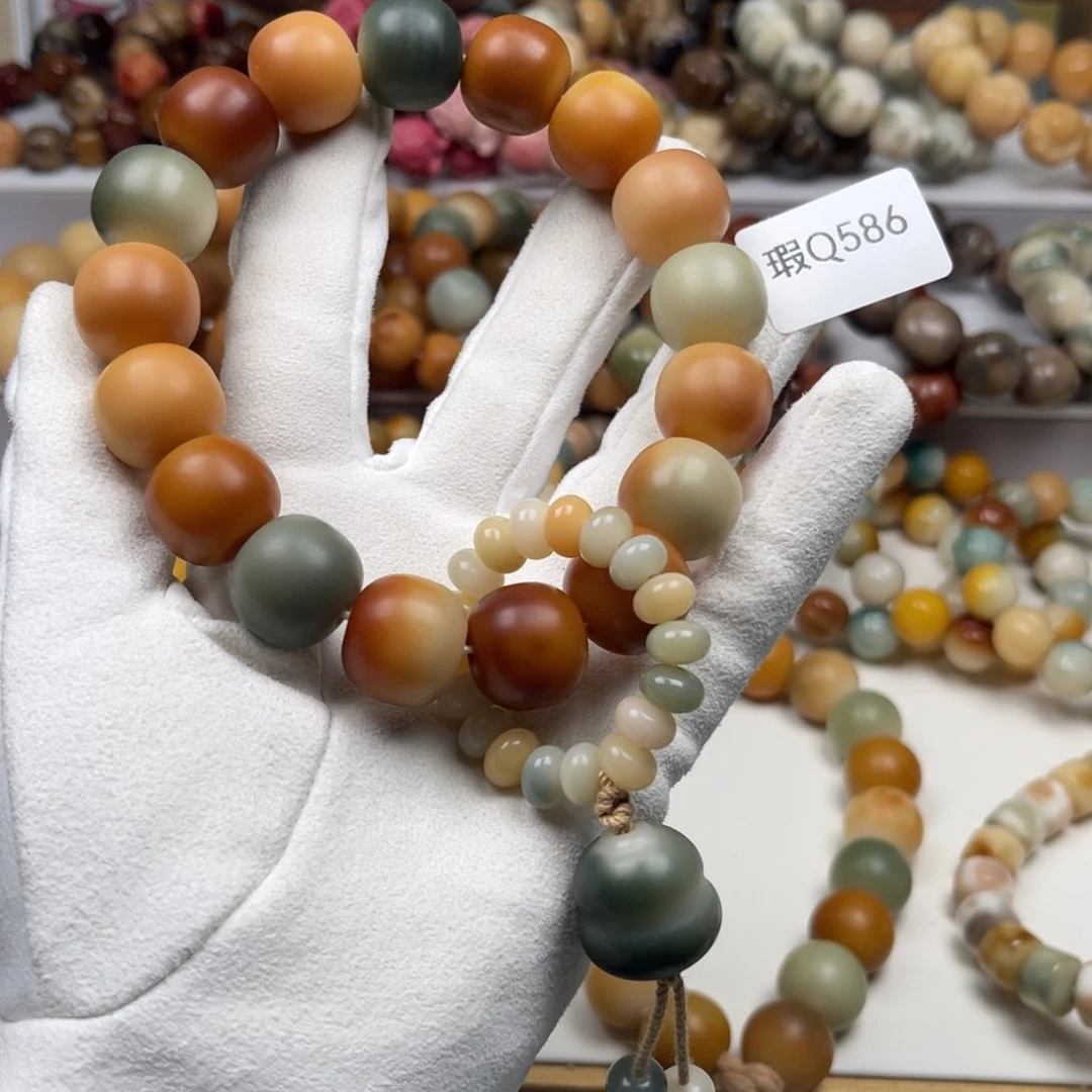 菩提根/象牙果吊坠L***T瑕Q586手持17mm