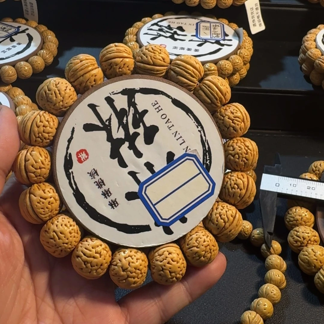 郑***桃核吊坠苹果园桃核手串2