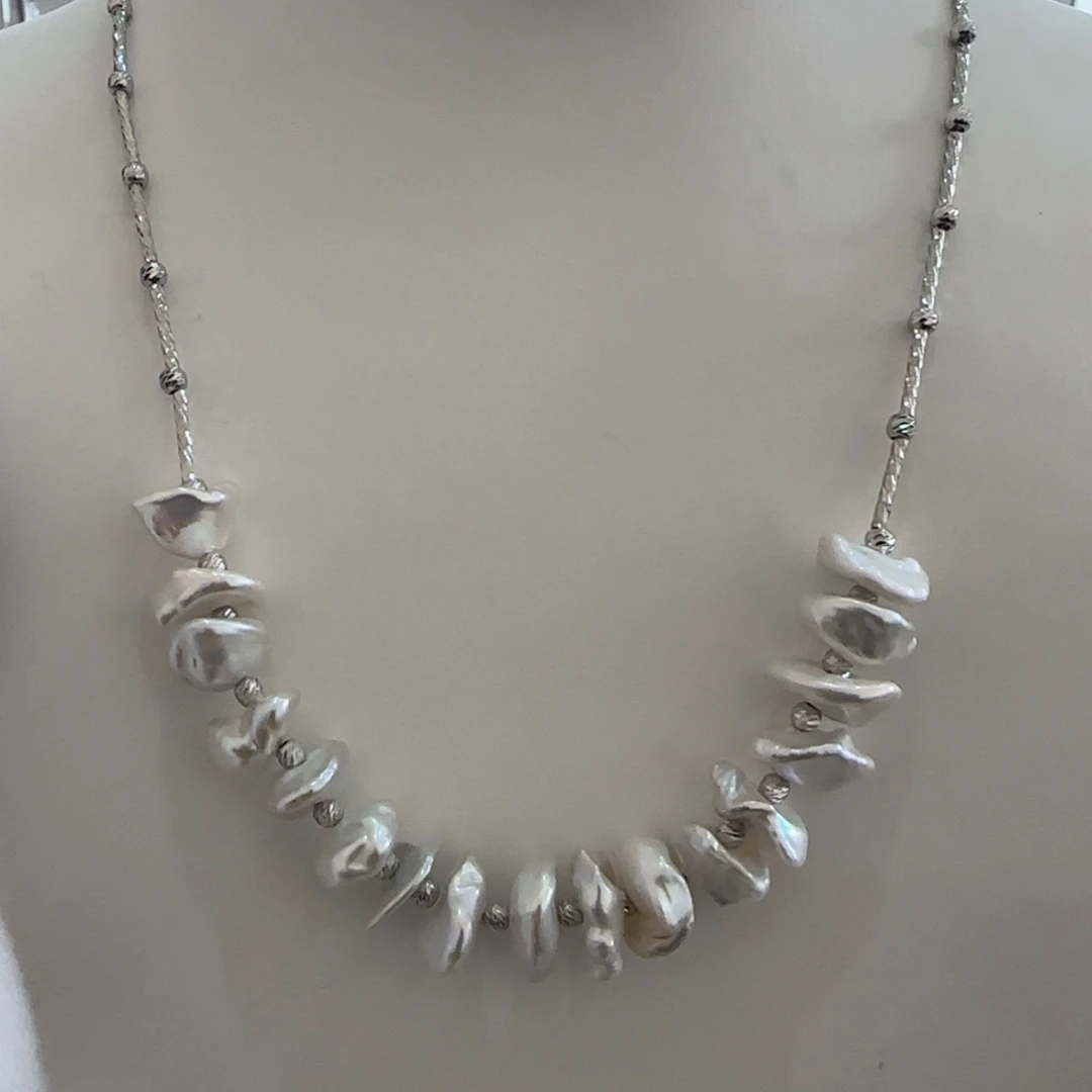 淡水珍珠银S925镶嵌颈饰哆****?