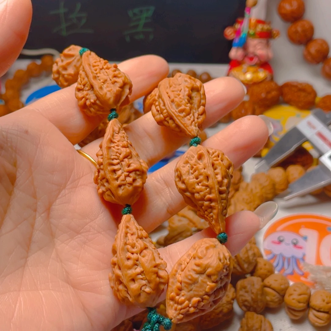 刘***刘吊坠文玩核桃麒麟角