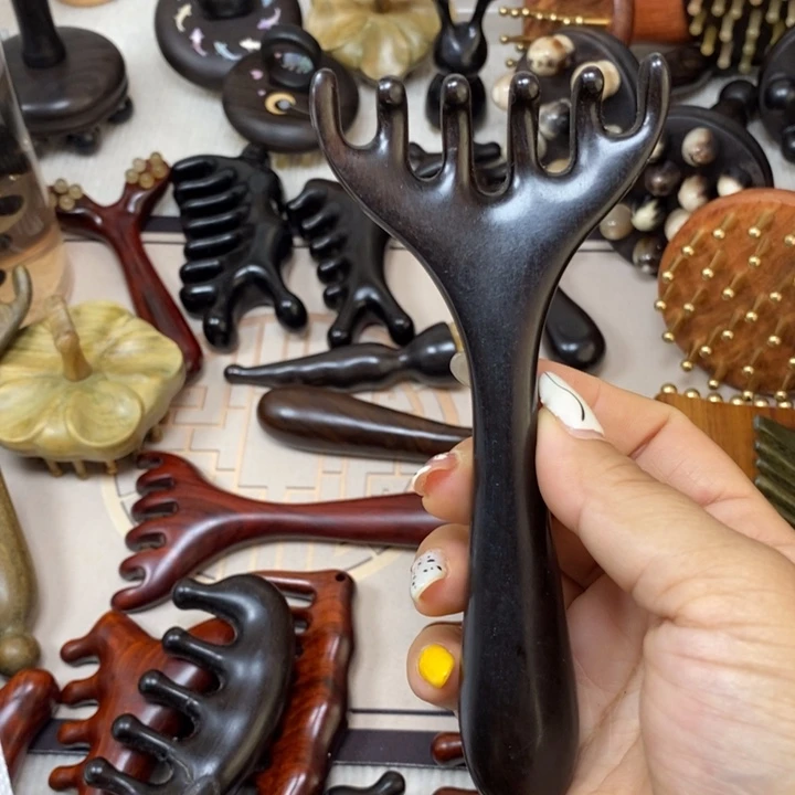 漫****紫光檀六指梳一个