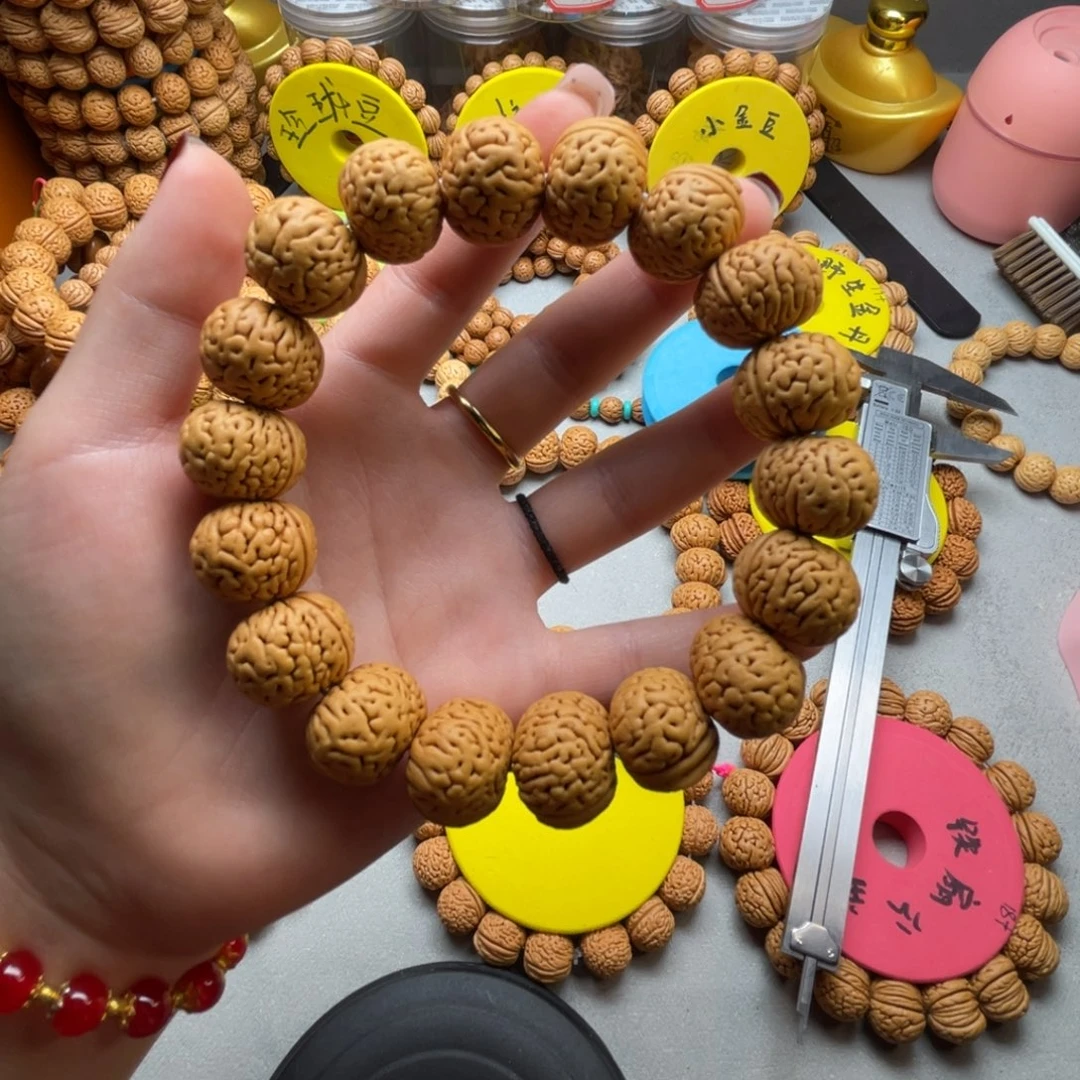 桃核手串王**涯金鱼肚手串