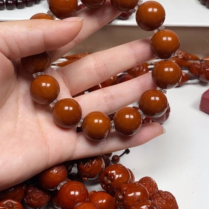 信***念橄榄核雕刻工艺的发展