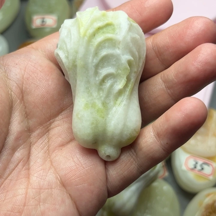 开****哥石材方解石手把件