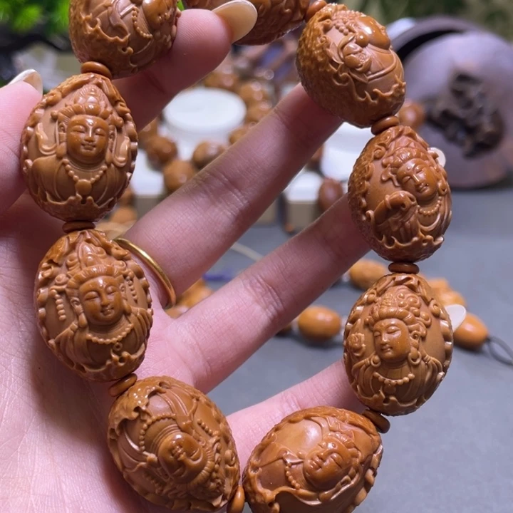 弄***儿橄榄核吊坠橄榄核雕