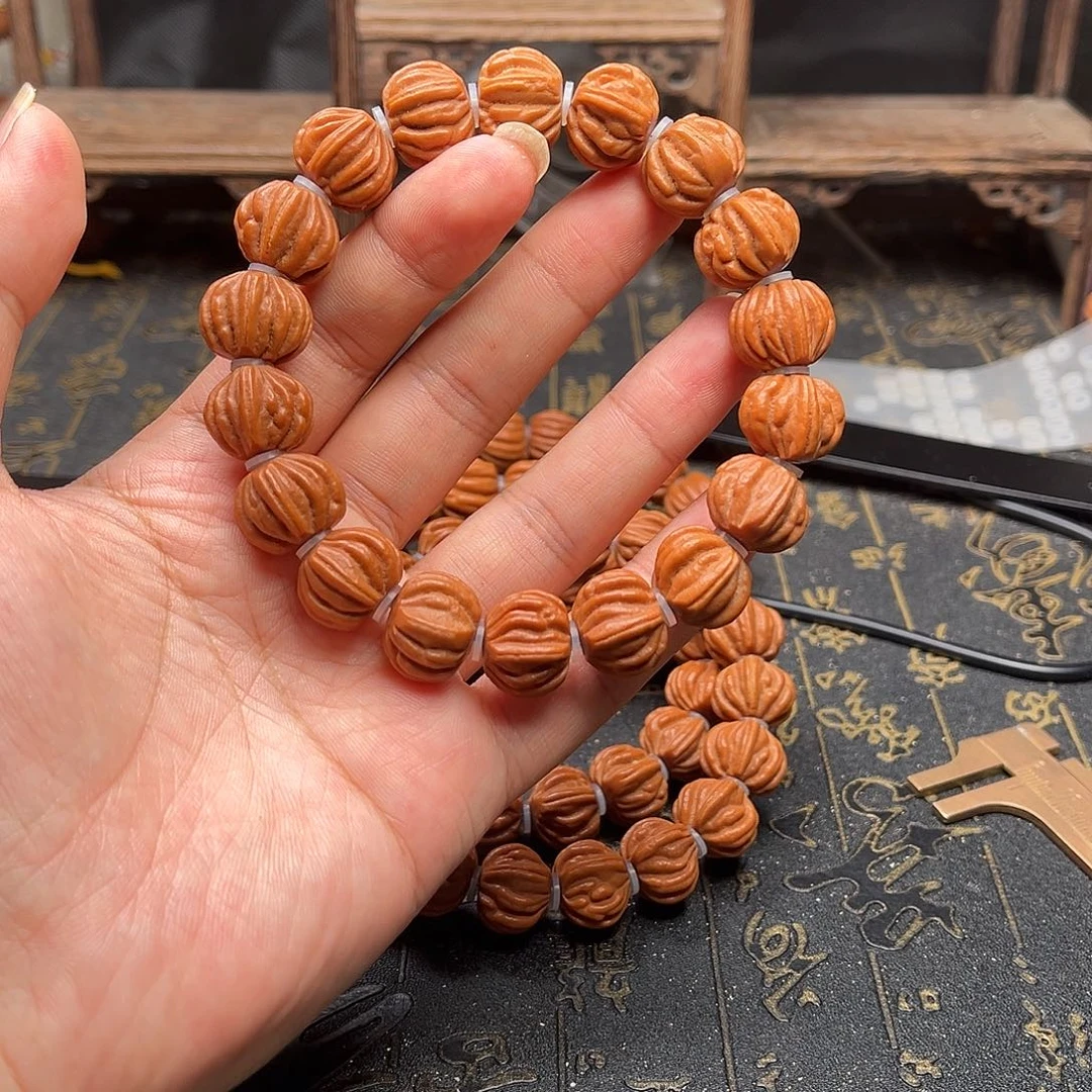 桃核吊坠佛手手串