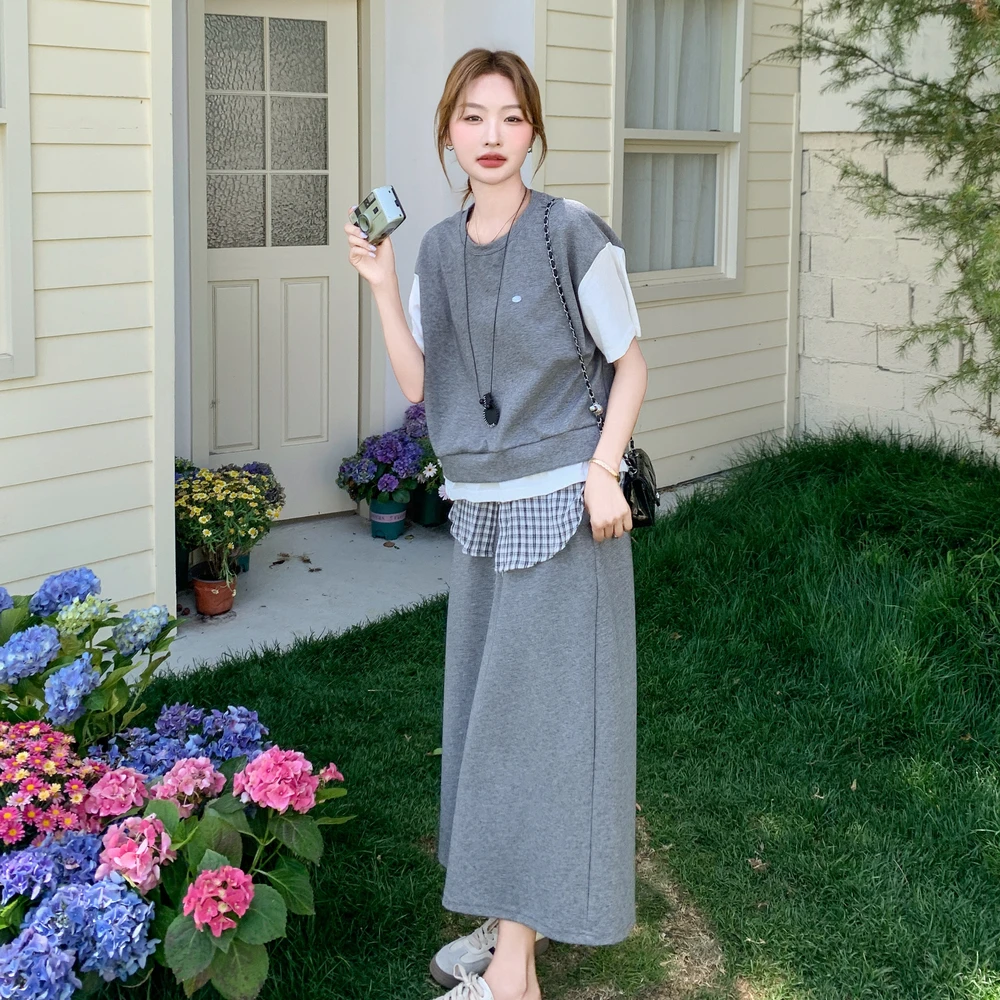 韩版学院风假两件上衣半身裙套装女2025夏新款设计感格子拼接下摆