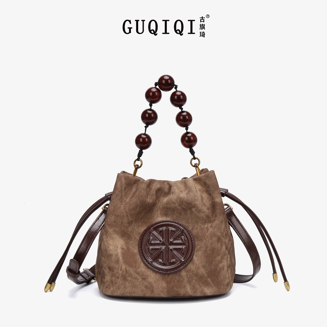 GUQIQI/古旗琦新款串珠单肩斜挎包福袋包GQ1236