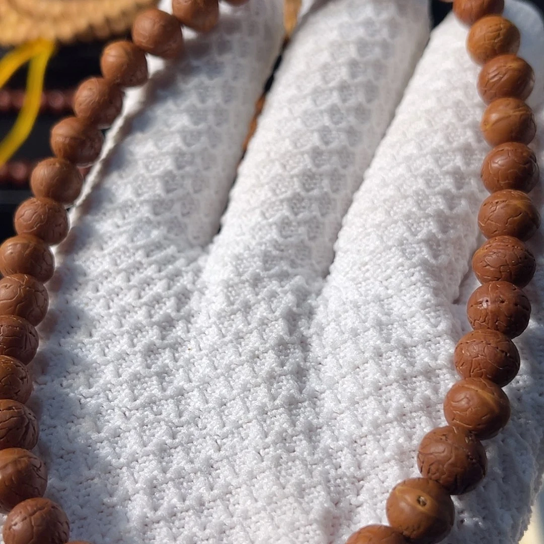 脆***人木质非金属木质非金属酸枣核 高定手持 36 颗