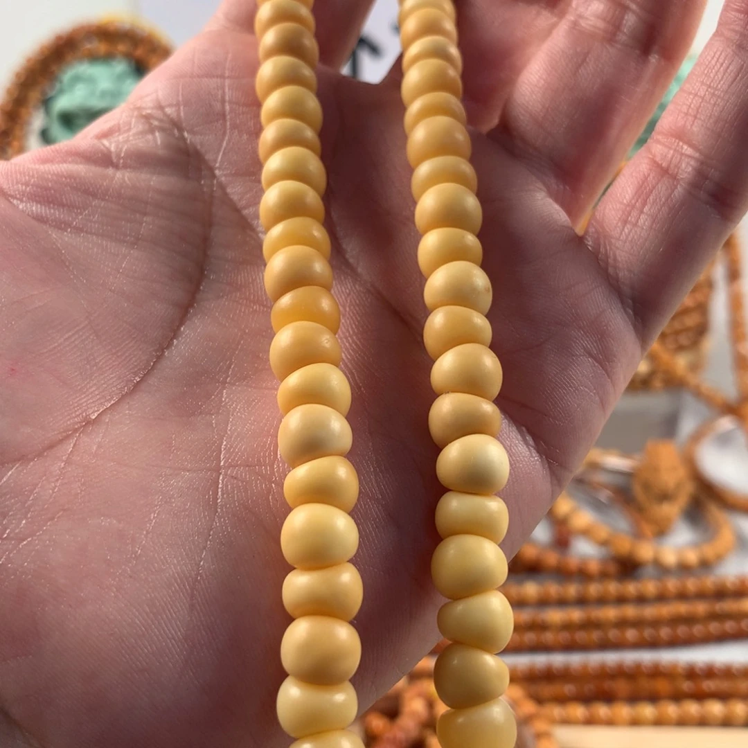 星月菩提吊坠特9蒜把蛋黄玉化大肠手持