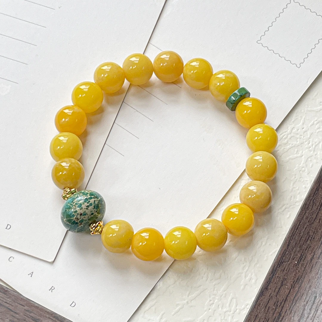 黄飘花圆珠沐汐手串10mm   A-Z188095