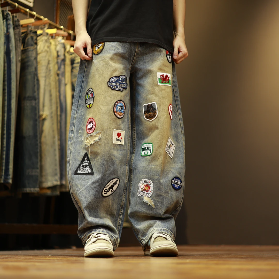 31061美式高街潮流水洗复古个性破洞宽松休闲弯刀牛仔裤