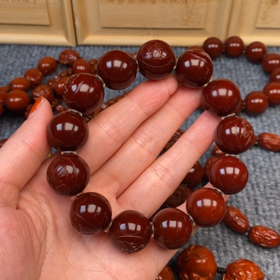 卢***亮橄榄核手串/手链光柱脸谱