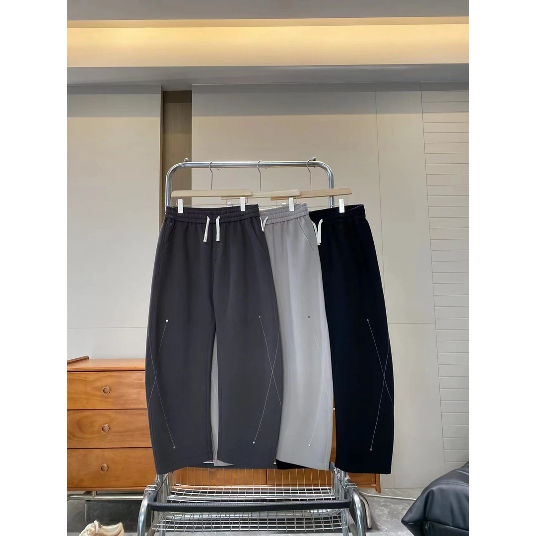 秋季新款铆钉抽绳微弯刀百搭潮流休闲净版简约长裤81129