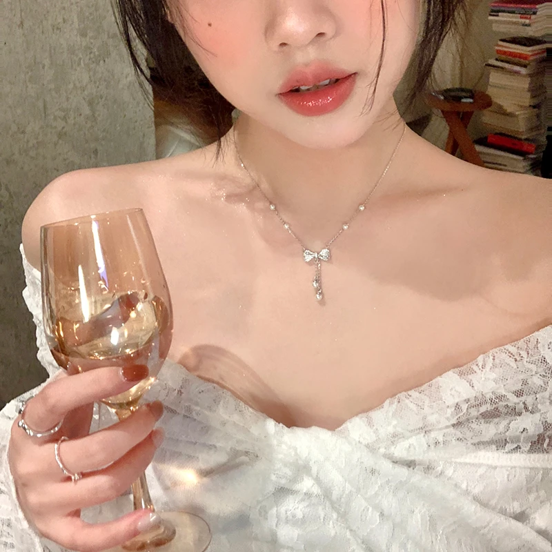 合金项链 珍珠蝴蝶结流苏项链配饰女轻奢小众锁骨链高级感颈链