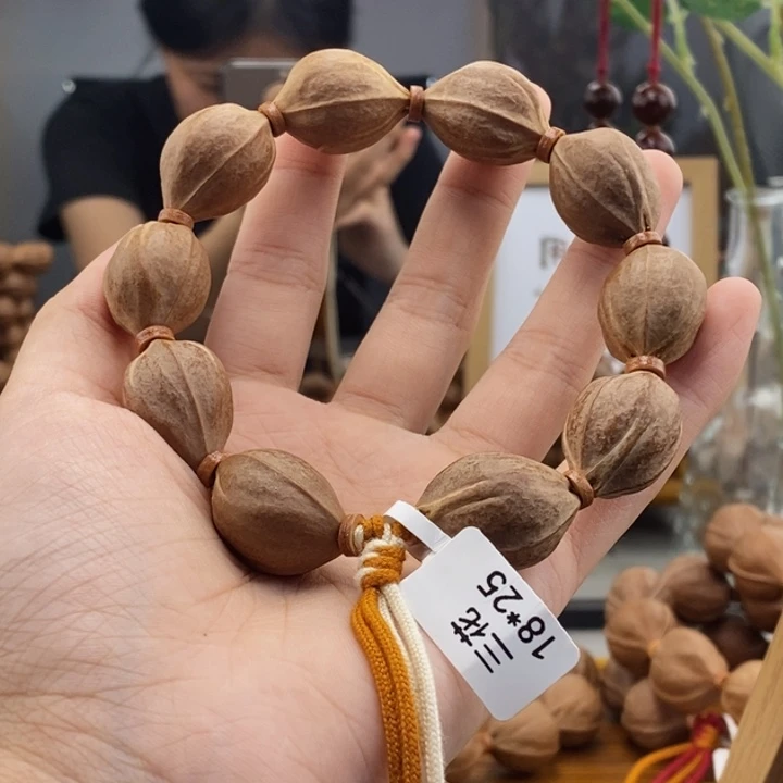 吊坠橄榄核请***咪梅林铁t