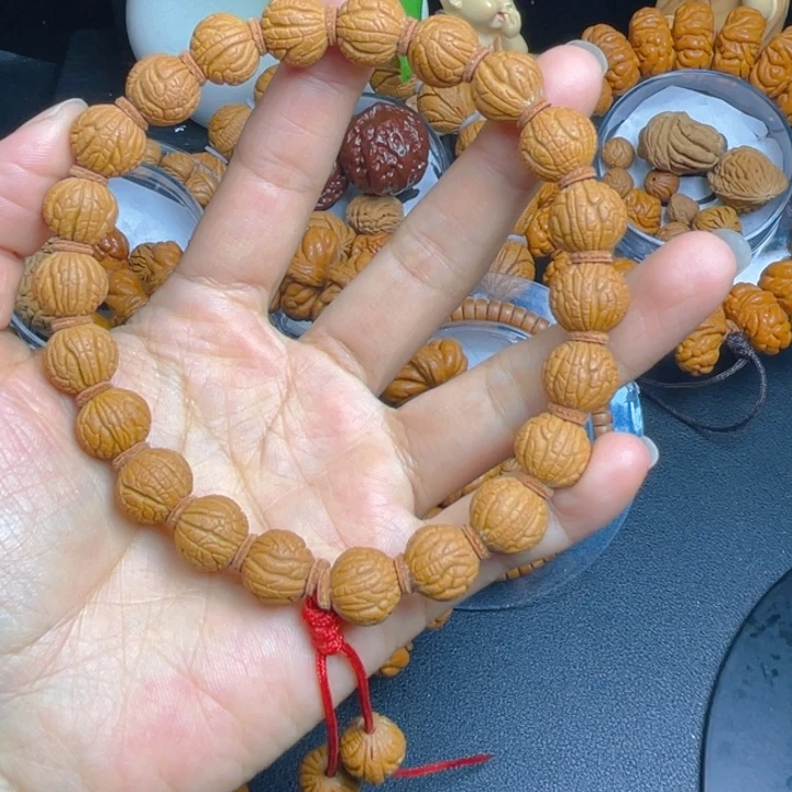 熙***鑫吊坠桃核龙纹桃核手串